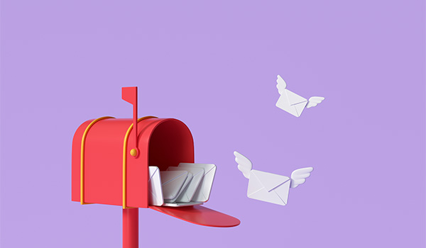 White envelopes with white wings leaving an open red mailbox with the send flag up, flying into the air and off to their respective destinations.